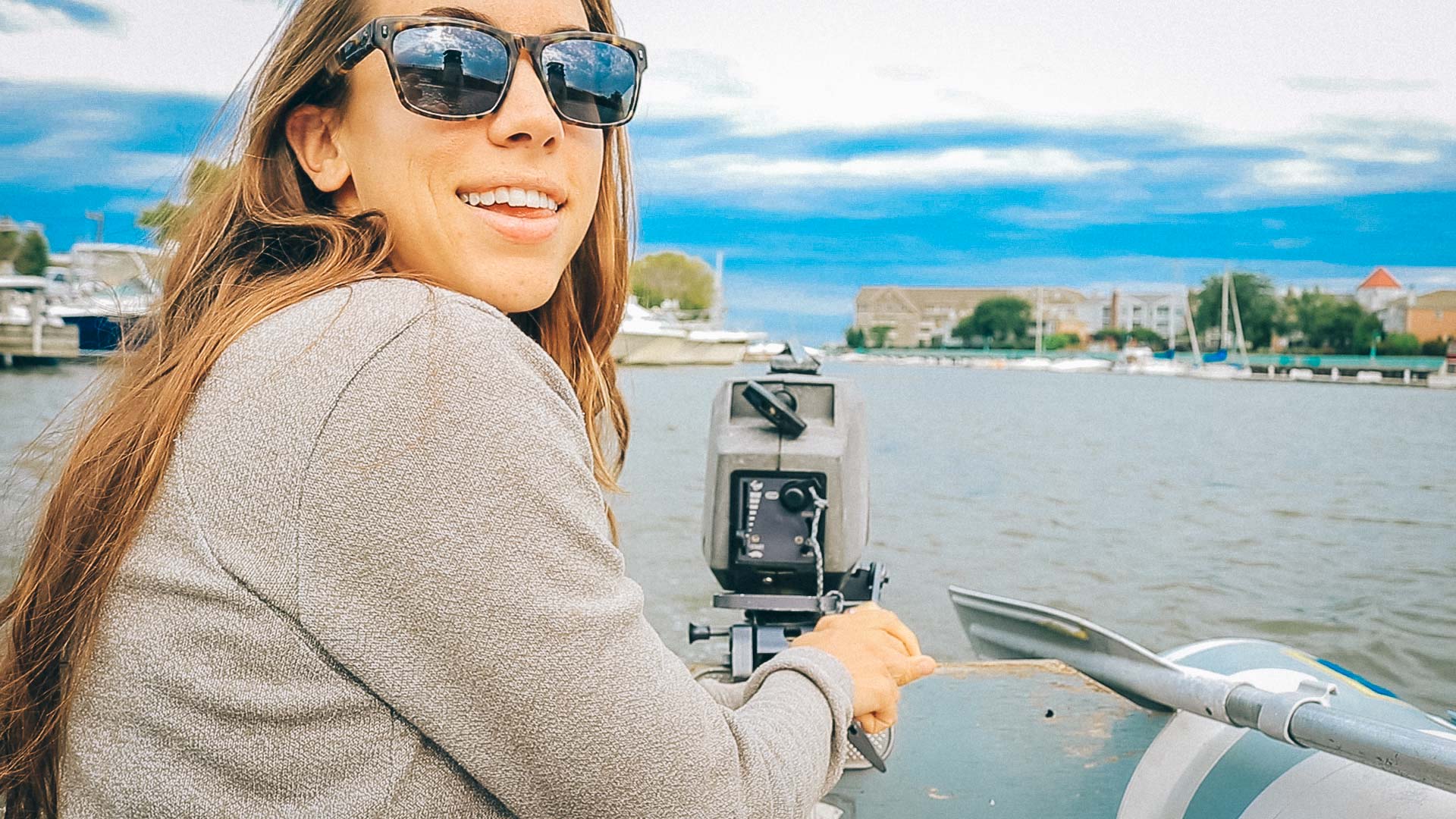 Lauren driving the dinghy | Sailing Soulianis